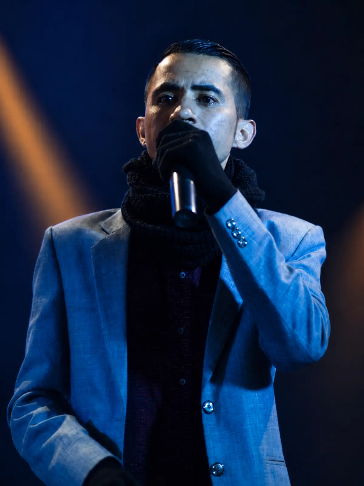 Arjun Lyngdoh speaking on stage during a communication and public speaking event
