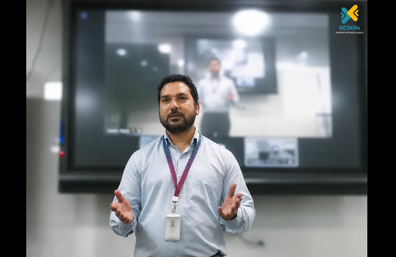Arjun Lyngdoh coaching communication in a professional presentation setting