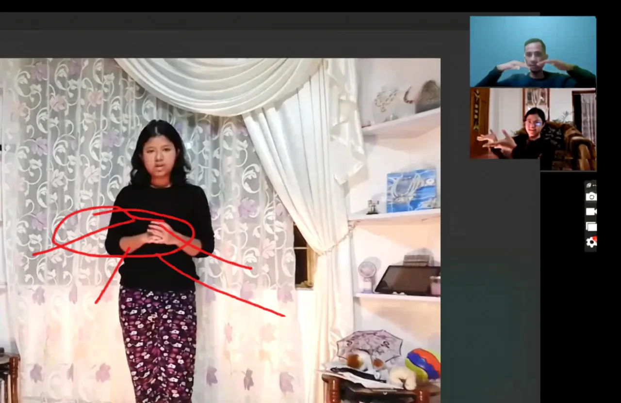 A participant practising a presentation during an online coaching session