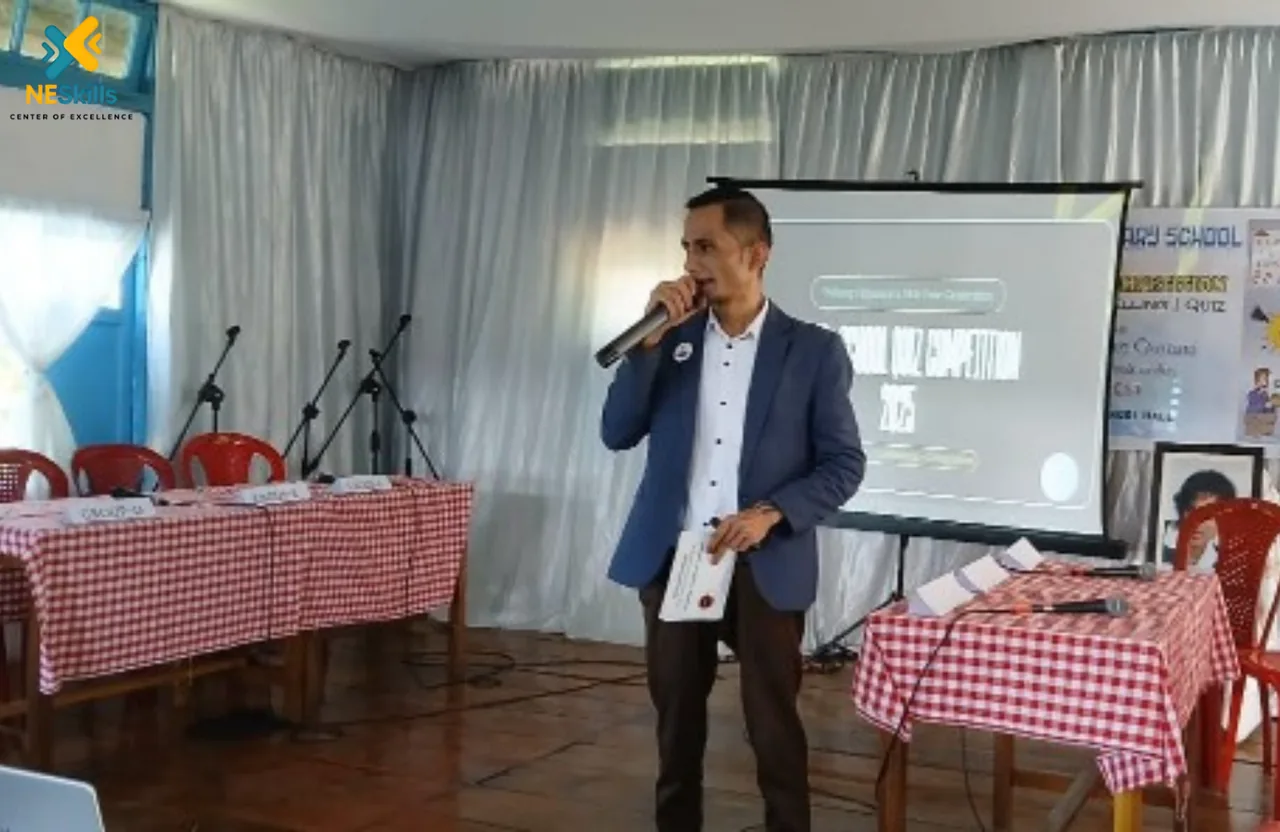 Arjun Lyngdoh speaking on stage during a communication workshop
